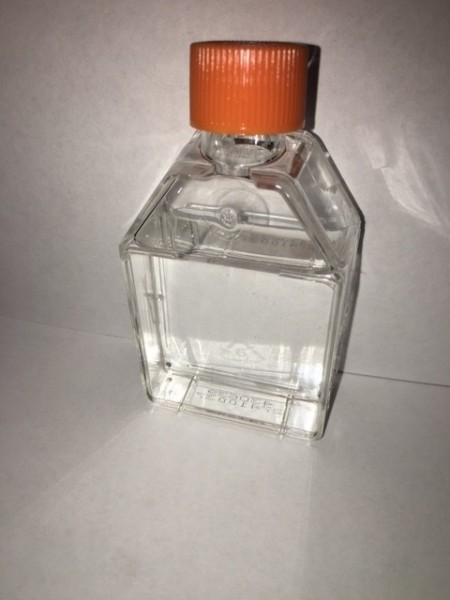 Clear bottle with orange lid containing C.Z. Nutrients for growing algae.